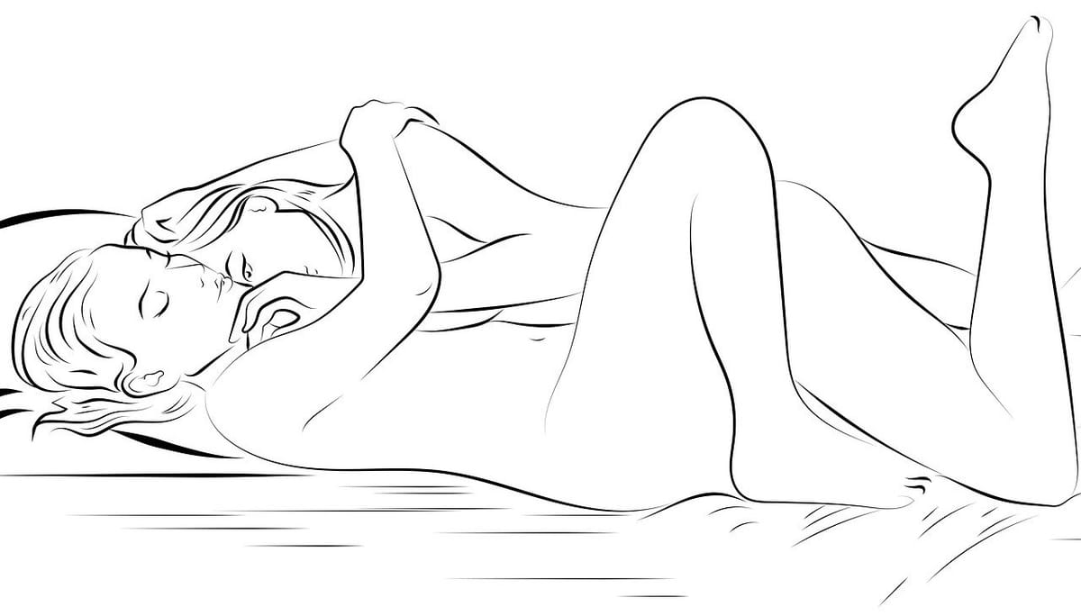 A line drawing of two naked women entwined on a bed